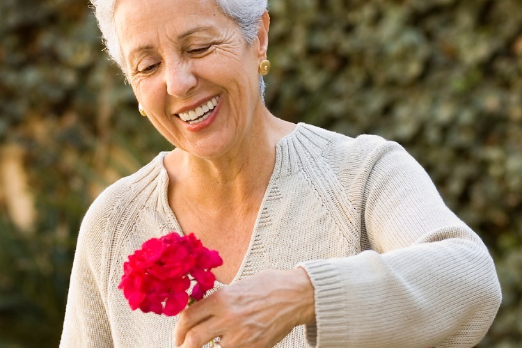 Female member cutting flowers