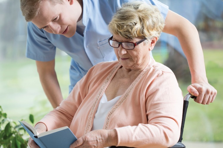 Staff member chatting with female patient