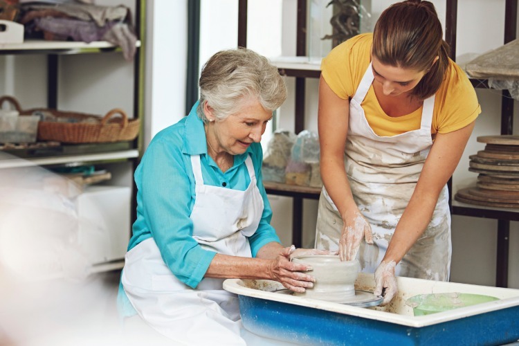 Senior woman in pottery class