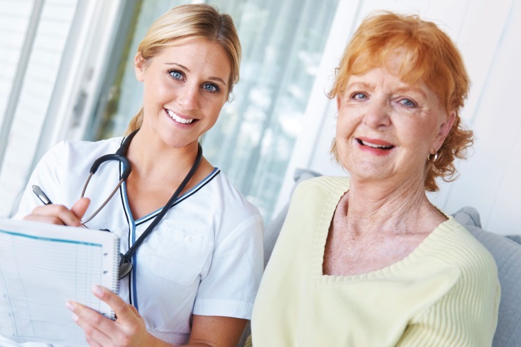 Nurse meeting with resident