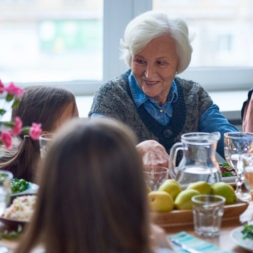 Senior woman treating her family to lunch