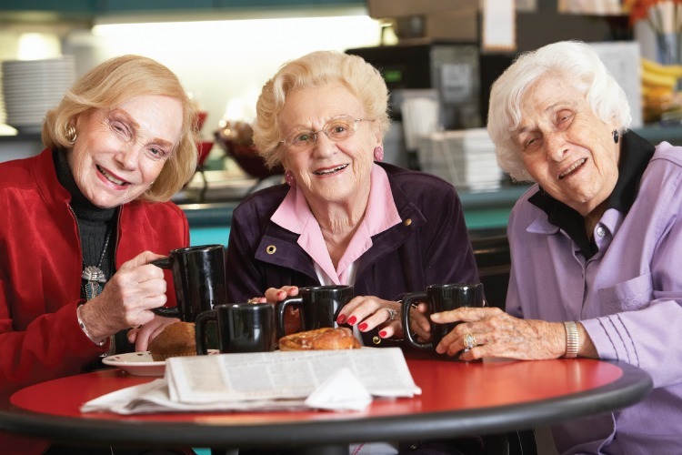 Three friends having coffee Female friends having coffee