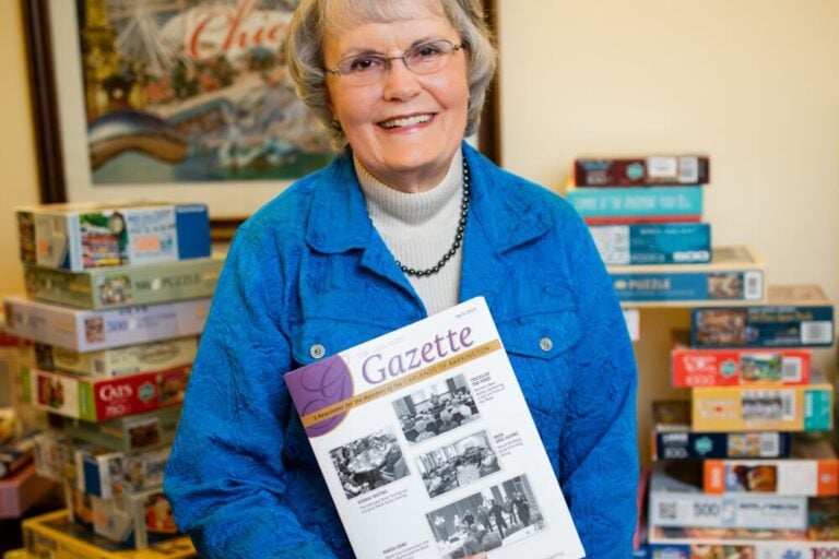Joyce Carlson holding The Gazette
