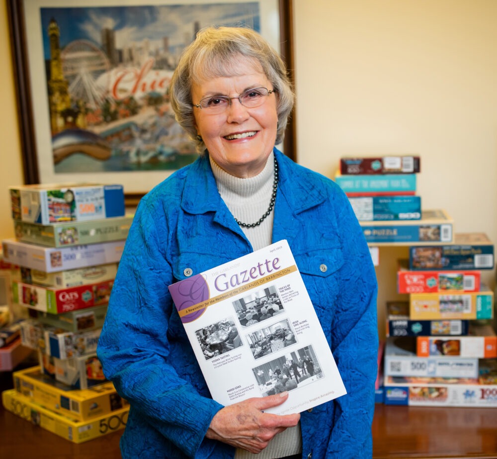 Joyce Carlson holding The Gazette