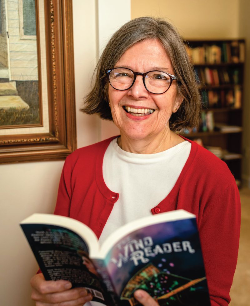 Dorothy Winsor holding a book she wrote.