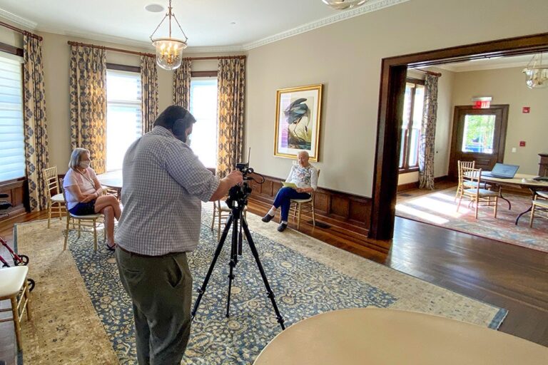 Vivian being video recorded room shot