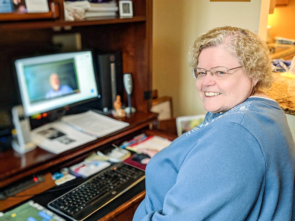 Peggy Clough at her computer