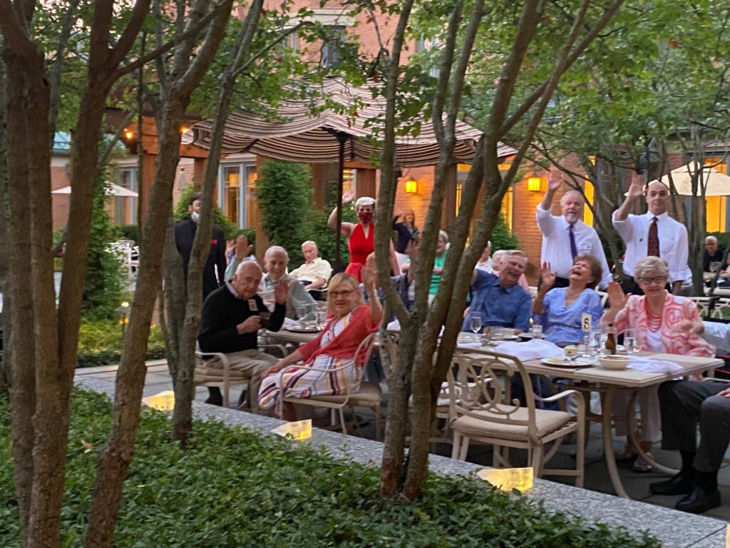 Group of Garlands Members enjoying an outside dining event