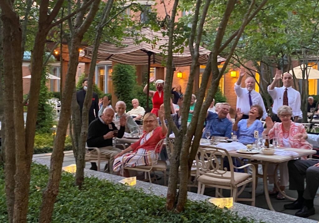 Group of Garlands Members enjoying an outside dining event