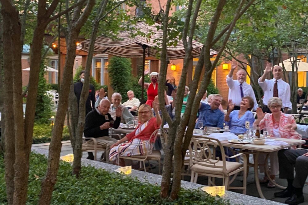 Group of Garlands Members enjoying an outside dining event