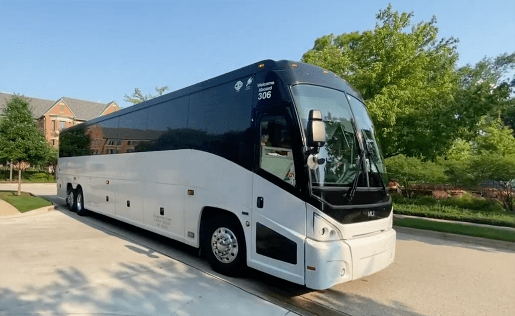 Coach Charter Bus ready for residents to board for travel club.