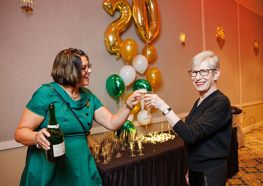 STaff member and resident toasting to 20 years