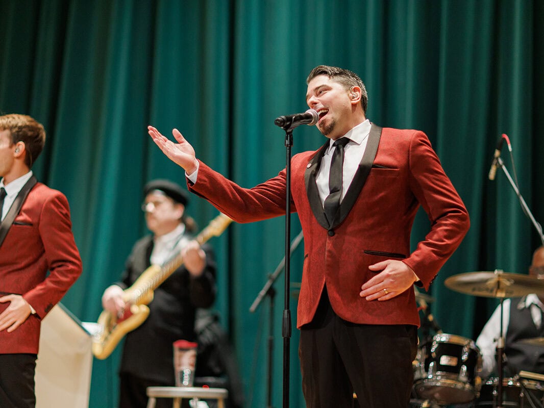 Lead singer of the band performing on stage