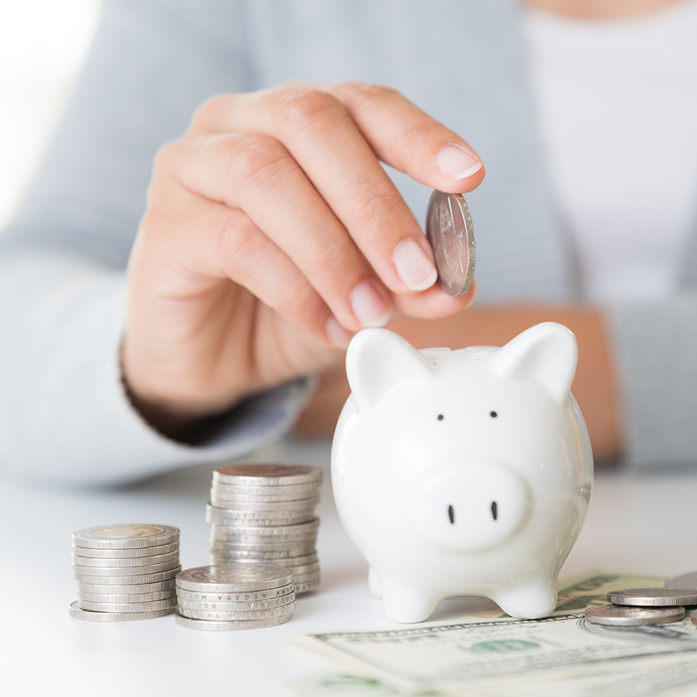 piggy bank with coins and bills