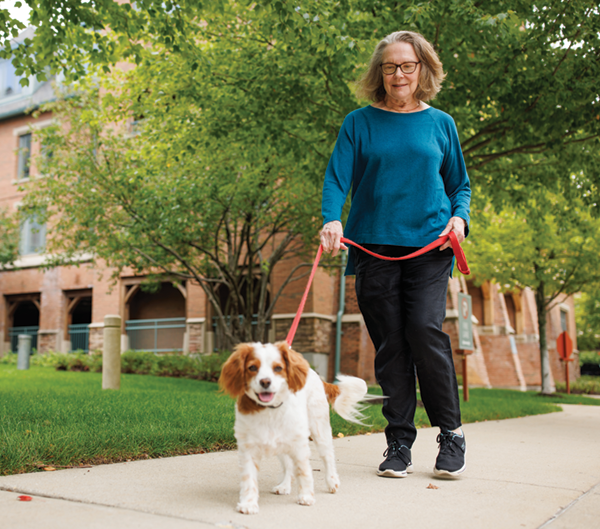 Woman walking her dog at The Garlands