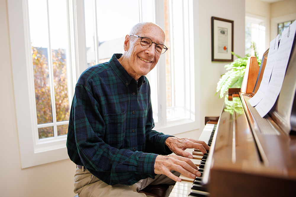 Male Garlands member playing piano.