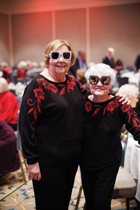 Two friends at a Garlands Elton John themed event