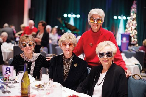 A table of friends at a Garlands Elton John themed event