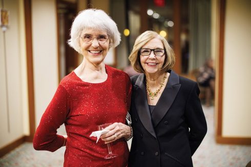 Two friends Celebrating at a holiday event