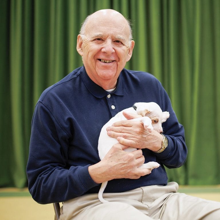 Garlands member holding a puppy