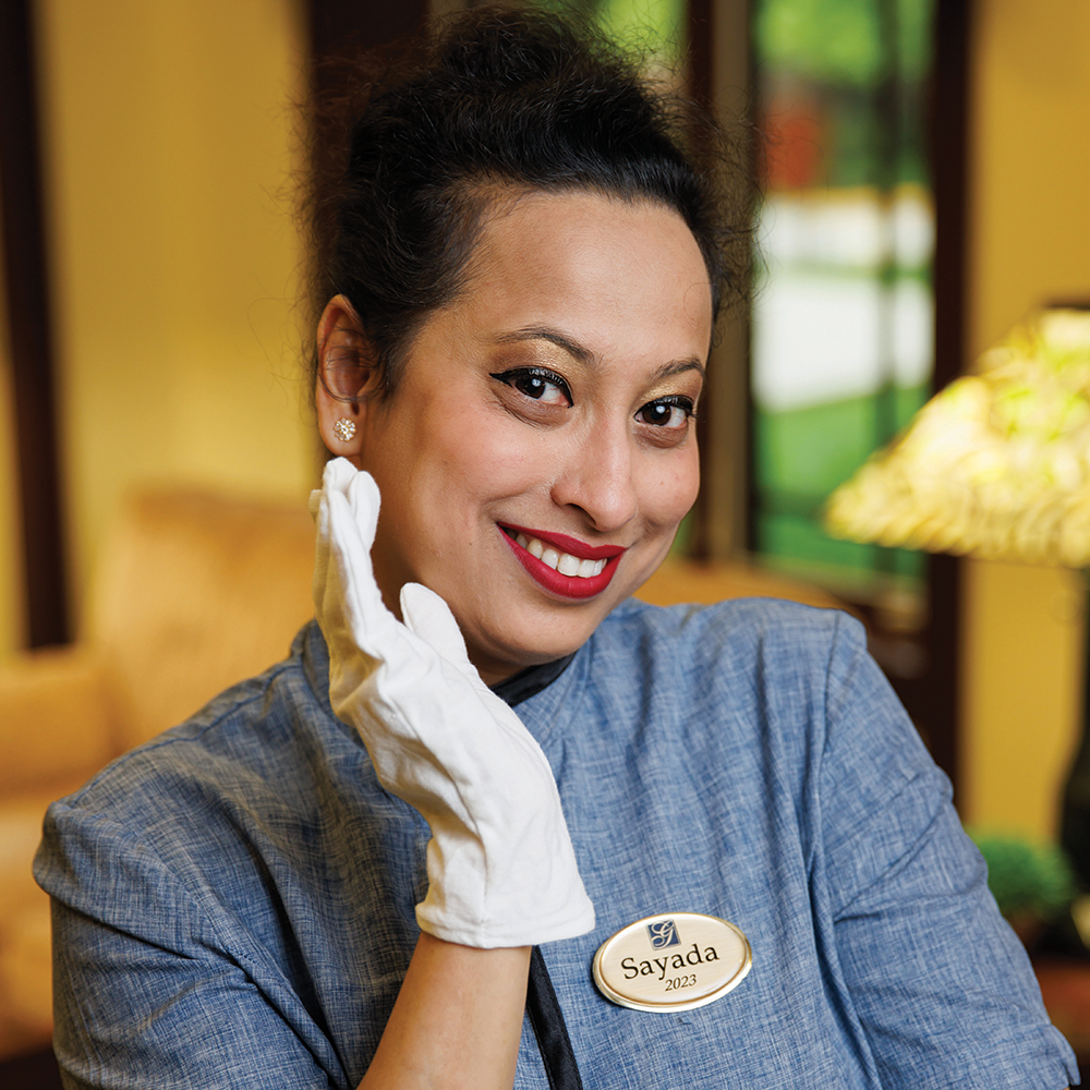 Sayada showing off her white glove cleaning skills