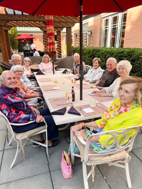Group of friends eating outside at a party