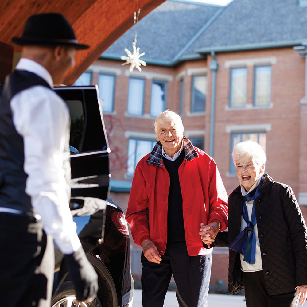 Anniversary-Couple-Going-to-Chicago Mary and Dick hopping into the Town Car to go on an adventure