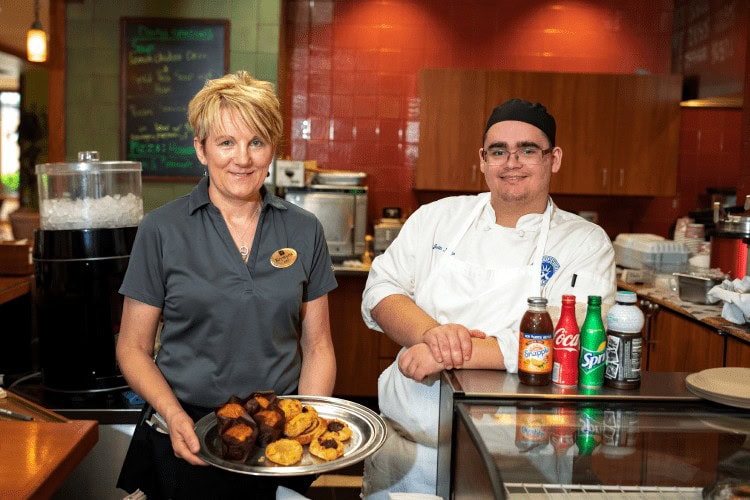 Server bring soup to woman member