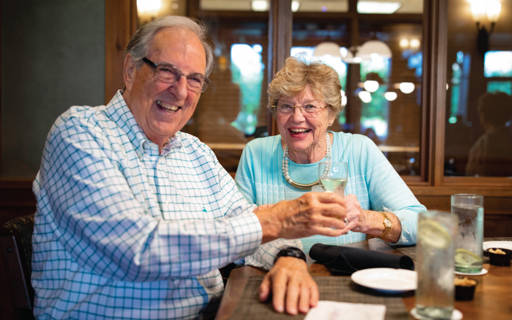 Husband and wife having dinner in the Timbers Lounge