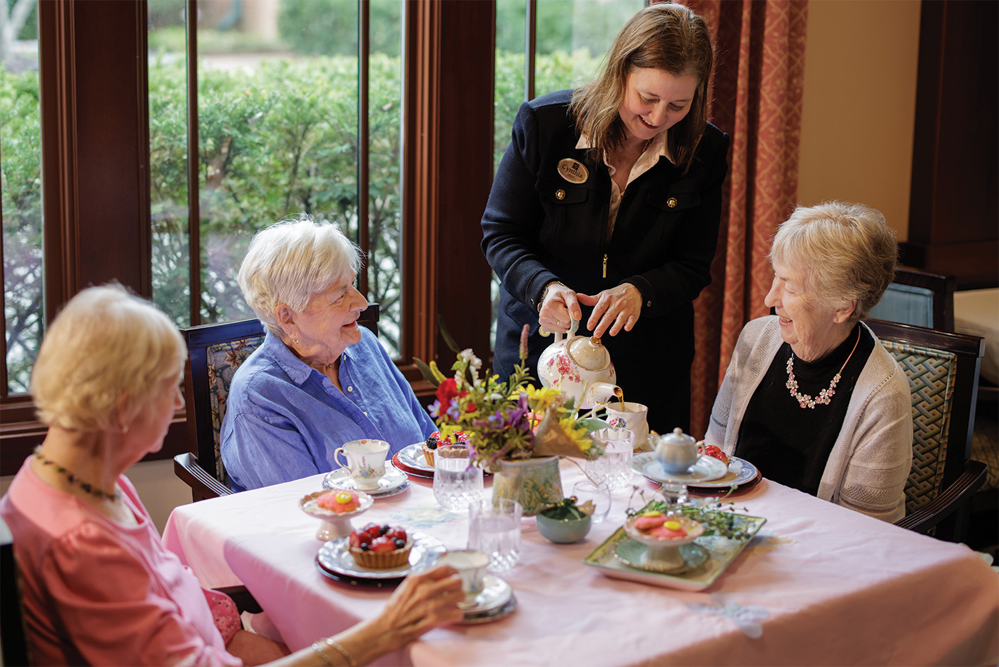 Garlands Staff pouring Tea for female members
